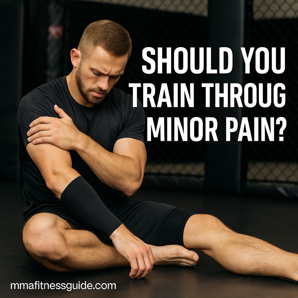 A muscular male MMA athlete sitting on the mats holding his shoulder in discomfort, with the title “Should You Train Through Minor Pain?” displayed.
