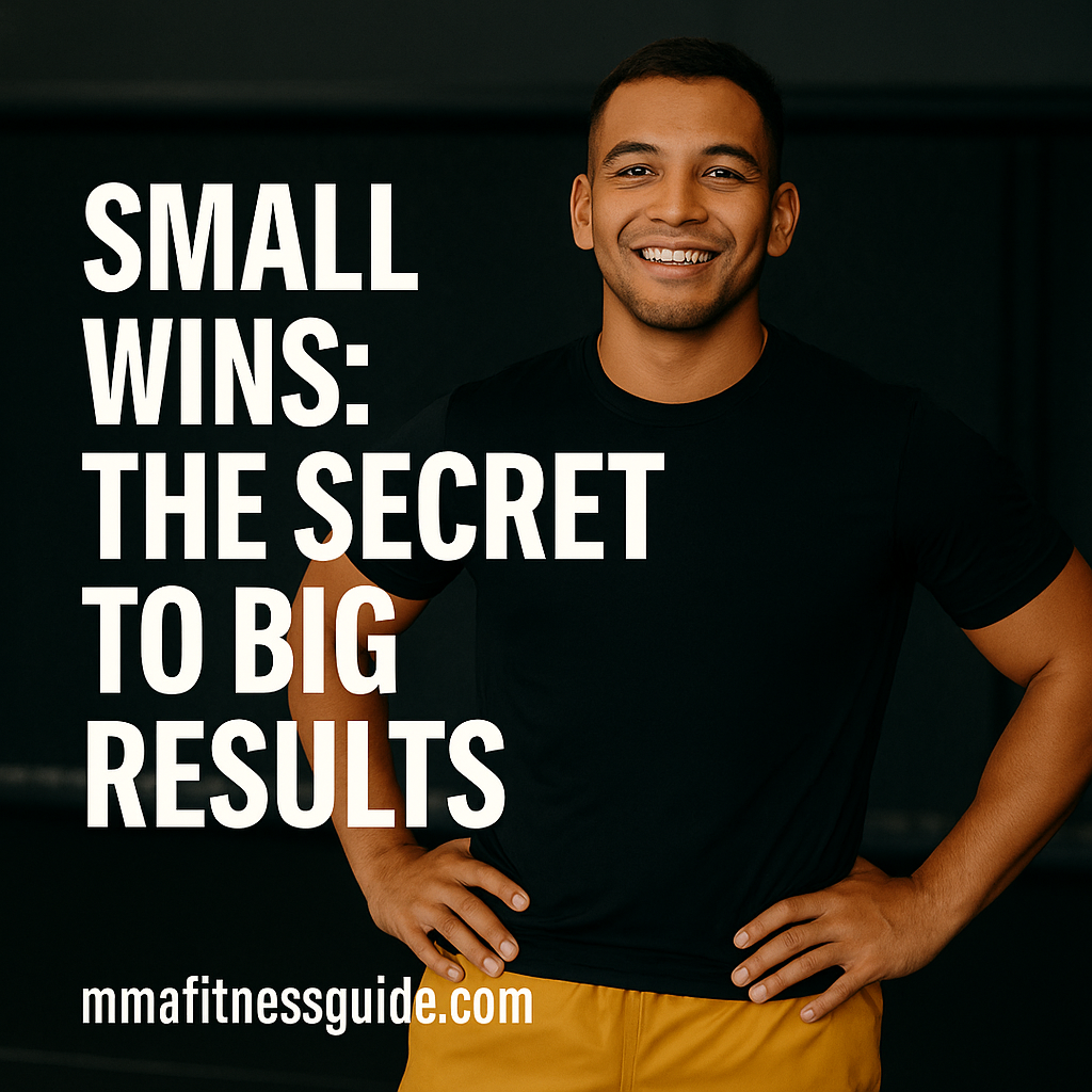 A smiling, tan-skinned male athlete standing confidently in an MMA gym with his hands on his hips, wearing yellow shorts, with the title “Small Wins: The Secret to Big Results” and the mmafitnessguide.com watermark.